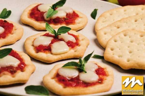 Small Pizzas with Tomatoes, Mozzarella and Fresh Basil